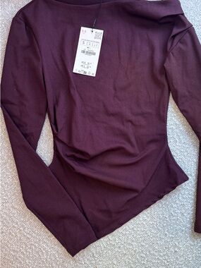 Asymmetrical long sleeve top